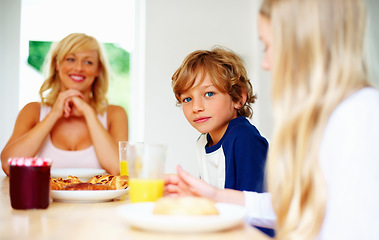 Image showing Happy family, morning and breakfast on weekend, portrait and eating for nutrition, orange juice and meal. Mother, children and enjoying food together for hunger, health and energy for good day