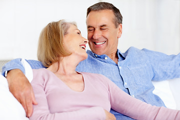 Image showing Senior, couple and face or laughing on sofa with support, relationship and bonding in retirement home. Elderly, man and woman with smile on couch in living room with relax, care and love in house