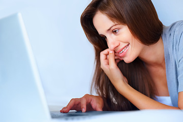 Image showing Relax, laptop and happy woman on bed reading email, social media post or online chat website in home. Computer, morning and girl with smile, networking or internet search for communication in bedroom