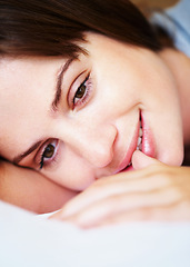 Image showing Thinking, smile and woman on bed in morning for sleeping, dreaming and comfortable at home. Happy, thoughtful and face of person in bedroom resting, nap and wake up for health, wellness and calm