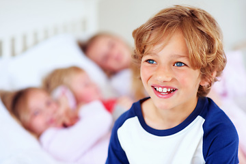 Image showing Happy, child and thinking with siblings on bed, love together and hug bonding on weekend in home. Boy, face or smile with thought in bedroom, family support or positive care in apartment for wellness