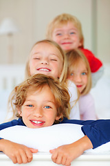 Image showing Portrait, smile or love with brother and sister sibling children on a bed in their home together. Family, happy or bonding with young boy and girl kids in the bedroom of an apartment on the weekend