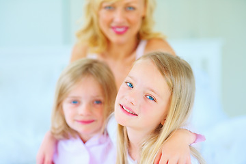 Image showing Smile, portrait and mother with children on bed for bonding, relaxing and spending time together. Happy, love and young mom chilling and resting with girl kids from Australia in bedroom of house.