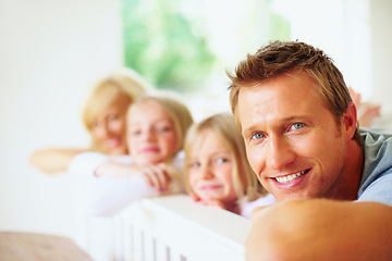 Image showing Portrait, smile and a family lying on a bed together while in their home on a weekend morning. Face, love and a happy father, mother and children in the bedroom of an apartment to relax for bonding