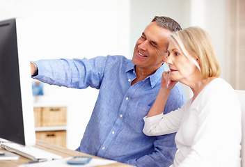 Image showing Investment, budget or senior couple with computer in home for retirement savings or pension planning. Banking, financial or mature man talking to a woman for house bills or profit growth on laptop