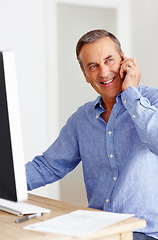 Image showing Mature man at desk with computer, phone call and networking for happy business negotiation. Cellphone, discussion and senior businessman in office with smile, conversation and connection with deal.