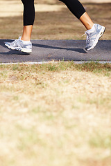 Image showing Running, cardio and shoes of woman in nature for fitness, speed and health challenge. Wellness, sports and workout with female runner training in outdoor path for exercise, fast and performance