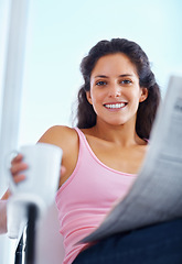 Image showing Portrait, smile and woman drinking coffee with newspaper in home, espresso or latte for breakfast to relax in living room in the morning. Face, tea cup and person reading news or info in apartment