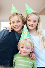 Image showing Family, children and portrait at birthday party, smile and celebration together in home. Happy kids, siblings and hat for event, face and bonding, care or support of brother, sister and girl in house