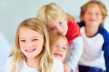 Image showing Portrait, happy or love with brother and sister sibling children on a bed in their home together. Family, smile or bonding with young boy and girl kids in the bedroom of an apartment on the weekend