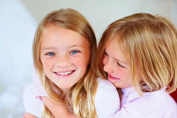 Image showing Portrait, girl and hug indoors with love for relax wellness, happiness and siblings support in home. Children, embrace and smile face for respect in unity, adore and family bonding for care in house