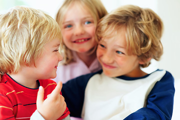 Image showing Family, kids and funny face in the bedroom with brother siblings playing together in their home. Love, smile or having fun with boy and girl children on a bed in their apartment for weekend bonding