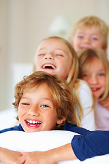 Image showing Portrait, love or laughing with brother and sister sibling children on a bed in the home together. Family, happy or bonding with funny boy and girl kids in the bedroom of an apartment on the weekend