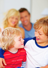 Image showing Hug, brothers and love for together on bed, relax wellness and happiness with sibling support in home. Boys, smile or embrace for care, family bonding or proud parents for morning peace in apartment