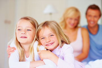 Image showing Portrait, siblings or sisters for hug together on bed, relax wellness and happiness with care support in home. Girls, embrace and smile face for bonding with proud parents and morning love in house