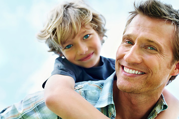 Image showing Father, son and portrait or happy with piggyback for bonding, relationship and freedom with blue sky in nature. Family, man and boy child with playing, care and love for excitement, peace and support