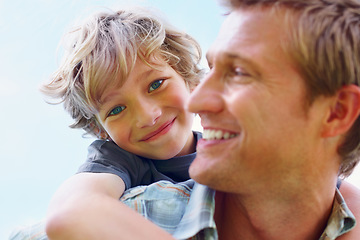 Image showing Father, son and happy outdoor with piggyback for bonding, relationship and freedom with blue sky in nature. Family, man and boy child with playing, care and love for excitement, peace and support