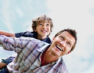 Image showing Father, son and smile outdoor with piggyback for bonding, relationship and freedom with blue sky in nature. Family, man and boy child with playing, care and love for happiness, peace and support