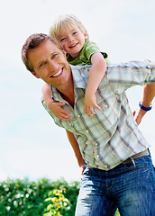 Image showing Father, son and portrait outdoor with piggyback for bonding, relationship and freedom in backyard of home. Family, man or boy kid with playing, care and love for happiness, peace or support in garden