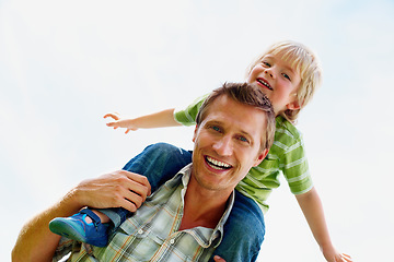 Image showing Father, son and portrait outdoor with piggyback for bonding, relationship and freedom with mock up in nature. Family, man and boy child with playing, flying and love for happiness, peace and support