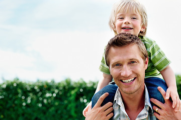 Image showing Father, son and portrait or smile with piggyback for bonding, relationship and freedom with blue sky in garden. Family, man and boy child with playing, care and love for excitement, peace and support