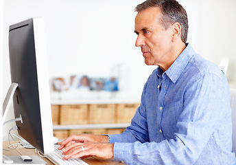 Image showing Mature man at desk with computer, typing and administration for business networking. Report, review and senior businessman writing website article for online feedback, research and office management.