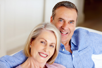 Image showing Smile, portrait or senior couple in home with love on sofa to bond or hug in a marriage commitment together. Happy, face or mature people in retirement with care or support in living room to relax