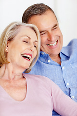 Image showing Senior, couple and face or laughing on sofa with support, relationship and marriage in retirement home. Elderly, man and woman with happy on couch in living room with relax, care and love in house