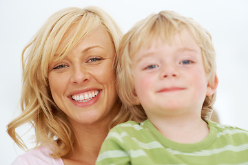 Image showing Portrait, face and mom smile with child for love, care and bonding together in studio isolated on white background. Mothers day, young boy kid and happy for childhood support, freedom and development