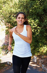 Image showing Running, health and portrait of woman in nature for fitness, speed and cardio challenge. Wellness, sports and workout with female runner training in outdoor path for exercise, fast and performance