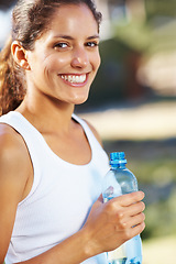 Image showing Fitness, portrait and happy woman with water in a park for running, wellness or weight loss training. Sports, liquid or runner face in nature for exercise with positive mindset, energy or attitude