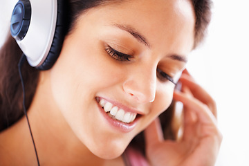 Image showing Headphones, face and happy woman listening to music playlist track, audio podcast or wellness sound. Closeup, happiness and relax person smile for media, song and streaming radio network