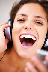 Image showing Music headphones, portrait and happy woman singing, excited and streaming track, audio podcast or playlist sound. Closeup shouting face, energy and singer voice, noice and listen to radio player