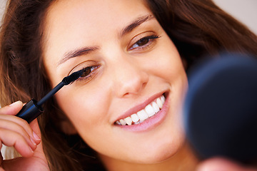 Image showing Mirror, makeup and happy woman with mascara brush application in a house for morning routine or eyelash care. Face, beauty and lady person smile for lashes, volume or cosmetic, extensions or results