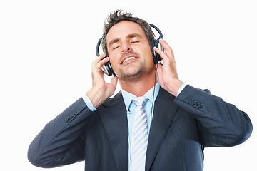 Image showing Businessman, headphones and relaxing to music, streaming radio and audio or song, chill on break. Male person, connection and dance to album, podcast and sound at studio, peace and white background