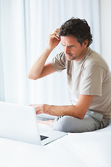Image showing Thinking, man in bedroom and laptop for work from home, confused and doubt in bed for freelance job. Technology, entrepreneur person and remote worker for online, company and marketing projects