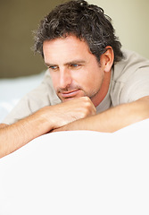 Image showing Thinking, relax and mature man in bed in the morning after nap, break or comfortable sleep at home. Smile, idea and male person from Canada wake up in bedroom for rest on cozy day in apartment.