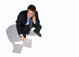 Image showing Business, phone call and man in studio with newspaper, networking or communication with top view floor mockup. Travel, smartphone or above male journalist with paper, article or contact us newsletter