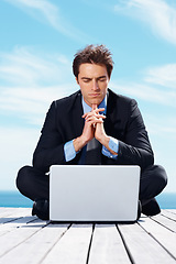 Image showing Laptop, thinking and business man by blue sky for working online, reading website and planning. Corporate, remote work and worker on computer brainstorming ideas for project, networking and research