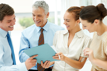 Image showing Staff, paperwork and collaboration on documents, planning and strategy in office for support. Colleagues, cooperation and brainstorm or analysis, discussion and meeting for report, teamwork on sale