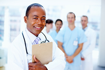 Image showing Doctor, black man and portrait of clipboard with medical, healthcare and clinic staff in a hospital. Teamwork, job and stethoscope of a nurse and surgeon with professional team ready for working