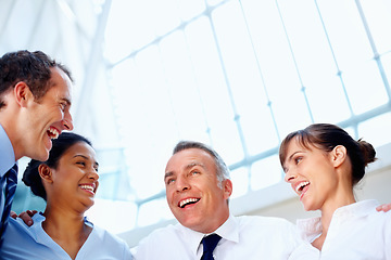 Image showing Businesspeople, together and excitement with low angle in office for diversity, unity and support. Corporate, man and woman with happiness for global, success or goal with future, partnership or team