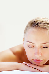 Image showing Woman, sleeping and closeup on bed in spa for health, wellness and recovery with rest, peace and quiet. Girl, mockup space and resort for rehabilitation, massage and physical therapy for body fatigue