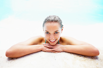 Image showing Portrait, edge and woman with a smile, swimming pool and vacation with weekend break, relax and happiness. Face, wet and person with joy, swimming and relax with holiday, getaway trip, calm or summer