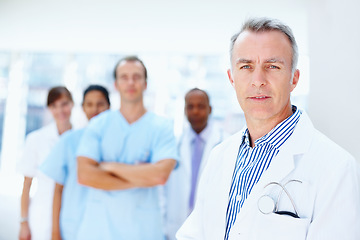 Image showing Doctor, man and portrait of expert with medical, healthcare and clinic staff in a hospital. Teamwork, leadership job and stethoscope of a nurse and surgeon with professional team ready for working