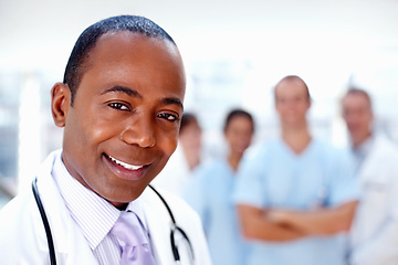 Image showing Doctor, black man and portrait of about us with medical, healthcare and clinic staff in a hospital. Teamwork, job and confidence of a medicine expert and surgeon with professional nursing team