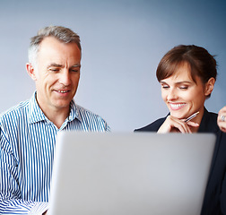 Image showing Conversation, planning and business people with a laptop, meeting and discussion with project, coaching and internet. Cooperation, staff and woman with man, computer and research with ideas or mentor