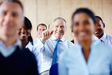 Image showing Happy businessman, meeting and question in seminar for interaction or collaboration at office. Senior man hands raised for answer, idea or solution in team conference or staff training at workplace
