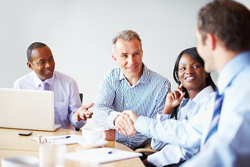 Image showing Business people, handshake and partnership with meeting success, b2b deal and onboarding or thank you. Professional manager, clients or mature boss shaking hands with team agreement and negotiation