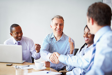 Image showing Business people, handshake and celebration for meeting success, b2b deal and congratulations or thank you. Professional clients or mature manager shaking hands with yes, excited and group negotiation